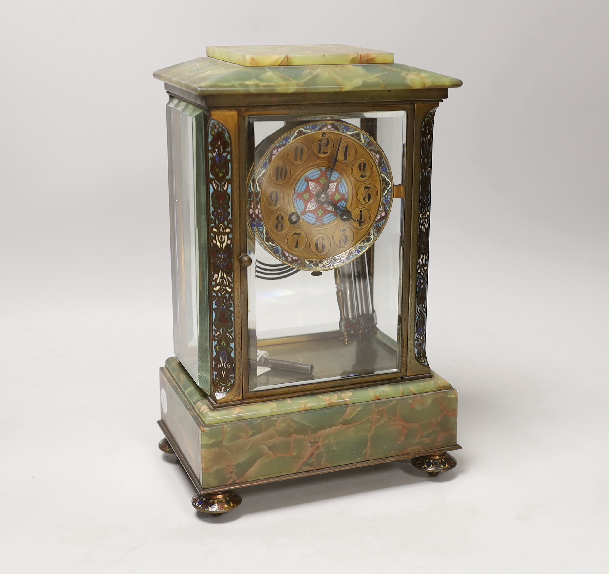 An early 20th century French green onyx and champleve enamel four glass mantel clock, 31cm